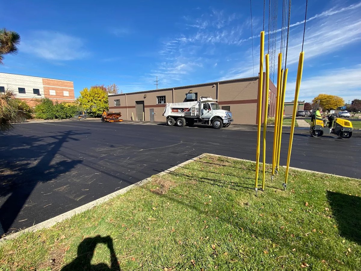 Finished commercial pavement with safety bollards