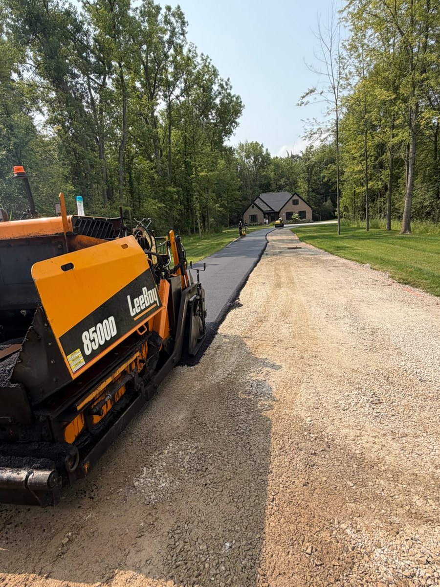 Freshly paved residential asphalt driveway
